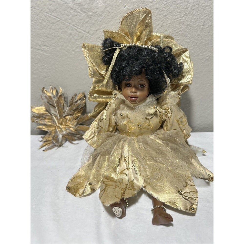 Vintage African American collectible porcelain doll.D